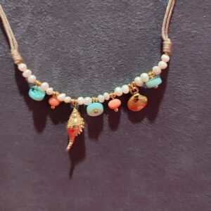 Pulsera cahrms caracola y almeja