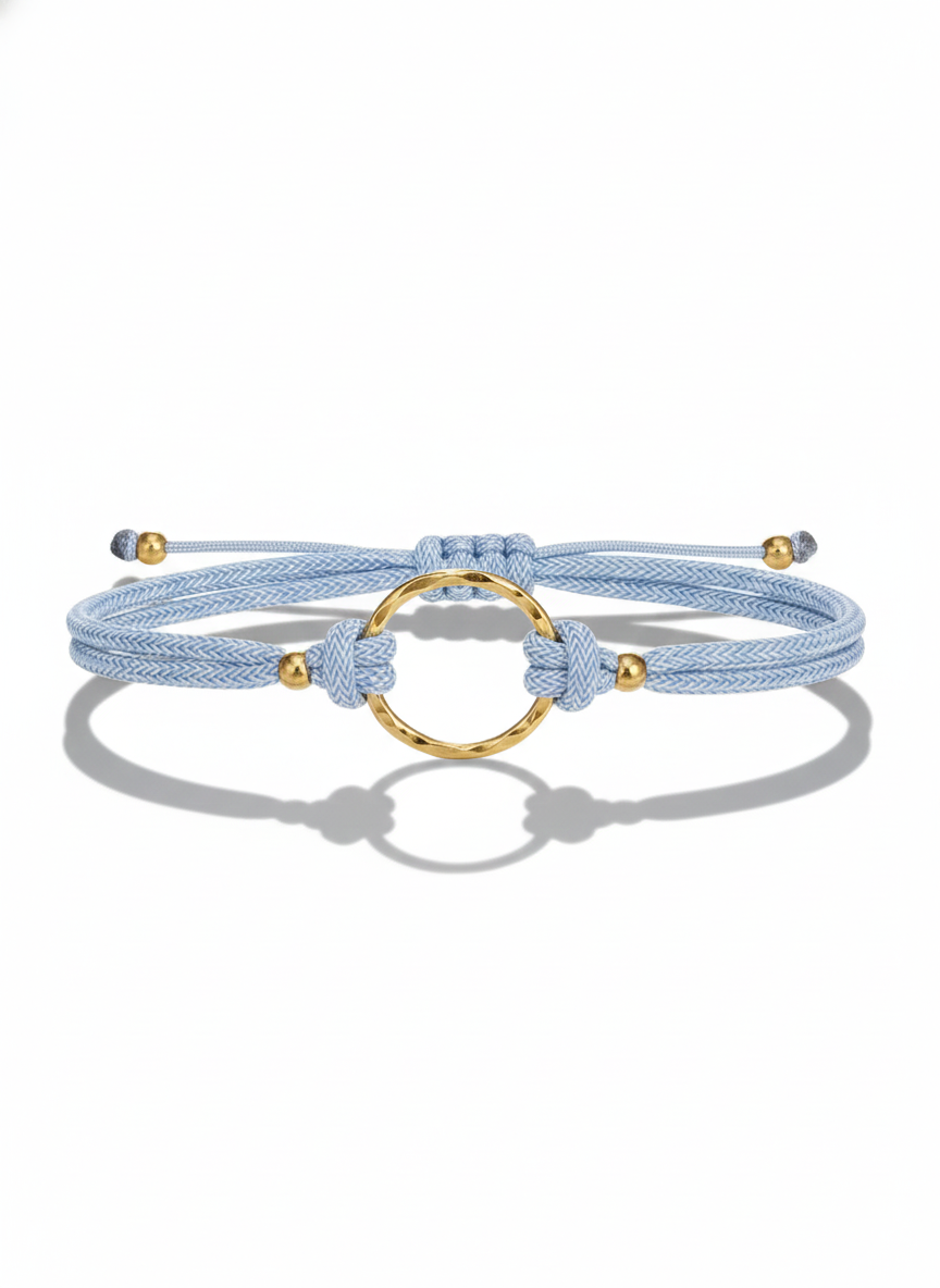 Pulsera aro dorado enlazado con cordon azul